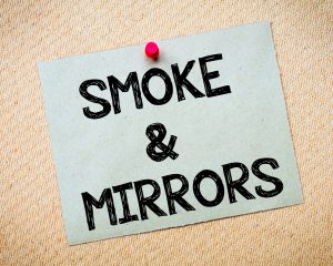 Smoke and mirrors written on sticky note